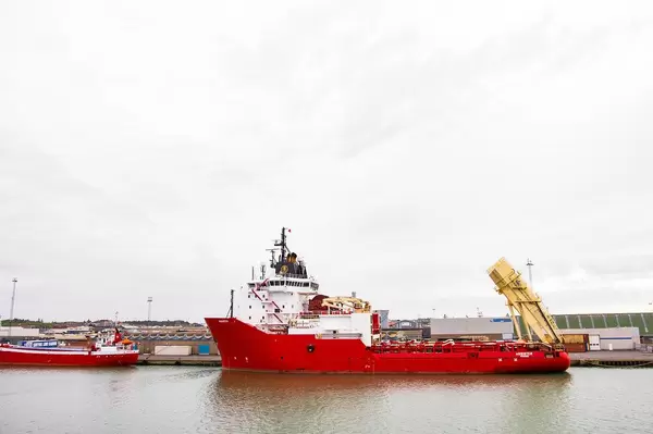 Small red cargo ship in Danish shores