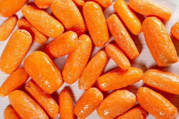 Small ripe carrot background. Top view (Flip 2019)