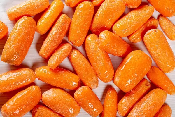 Small ripe carrot background. Top view