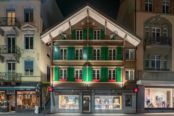 Small Swiss old house with wooden window shutters in Interlaken at night