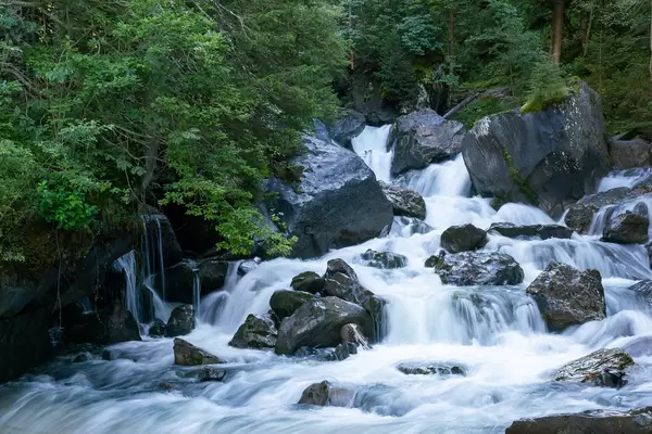 Small waterfall up in Swiss mountains
