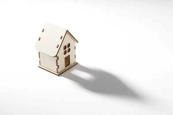 Small wooden house on white background