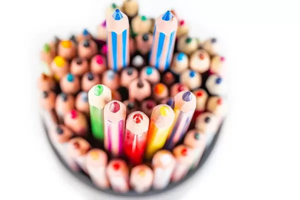 Smiley face made of colored pencils