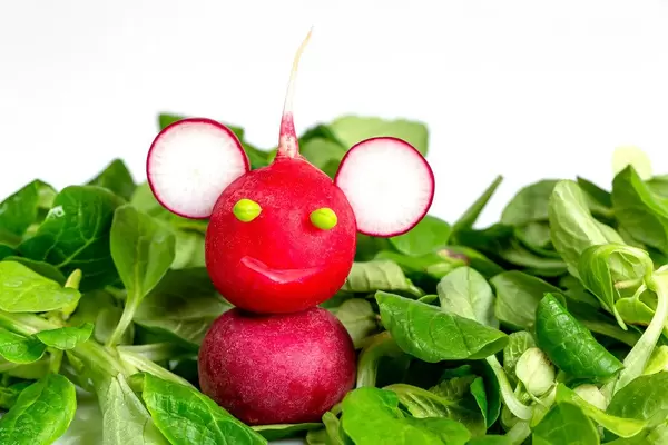 Smiling monkey made of radish