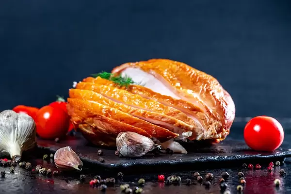 Smoked chicken breast with vegetables and spices on dark background (Flip 2019)