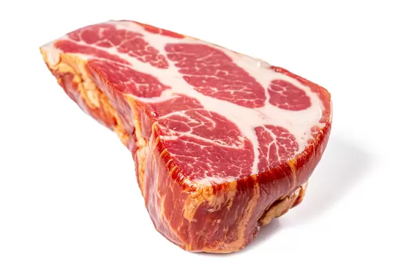 Smoked cured pork meat on a white background