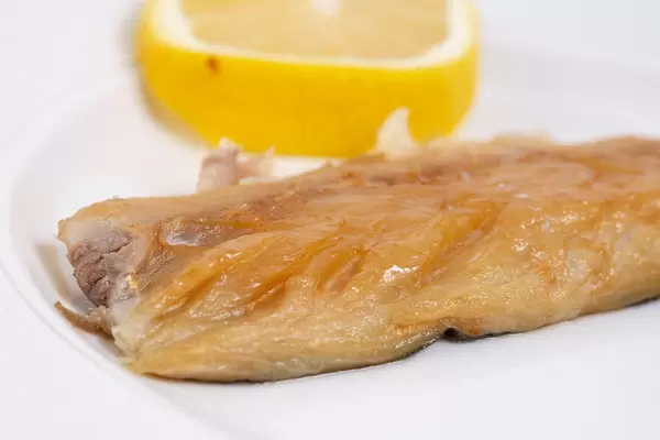 Smoked Mackerel fish closeup image with Lemon