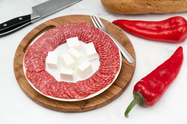 Smoked red Sausage arranged on the plate with Bread and Paprika (Flip 2019)
