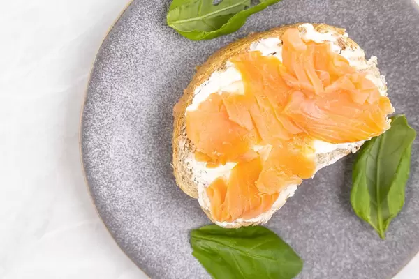 Smoked Salmon filet sandwich served on the plate