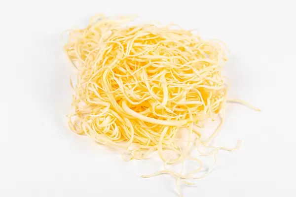 Smoked suluguni cheese on a white background