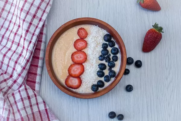 Smooothie bowl with Blueberries, Strawberries and Coconut Flake