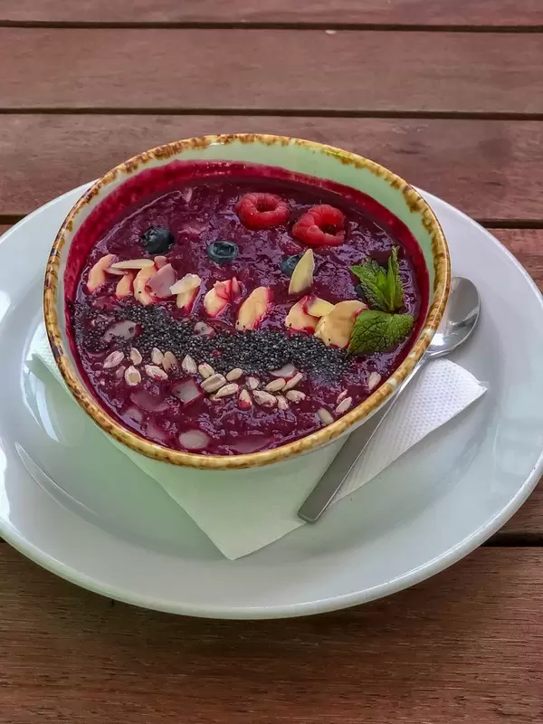 Smoothie Bowl at Avocado Cafe: bilberry, banana, beet juice, raspberry, blueberry, poppy seeds, sunflower seeds, almonds, mint