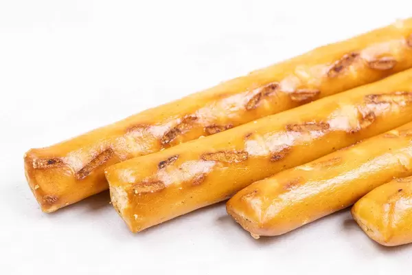 Snacks grisini isolated above white background