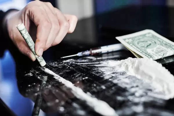 Snorting cocaine lines