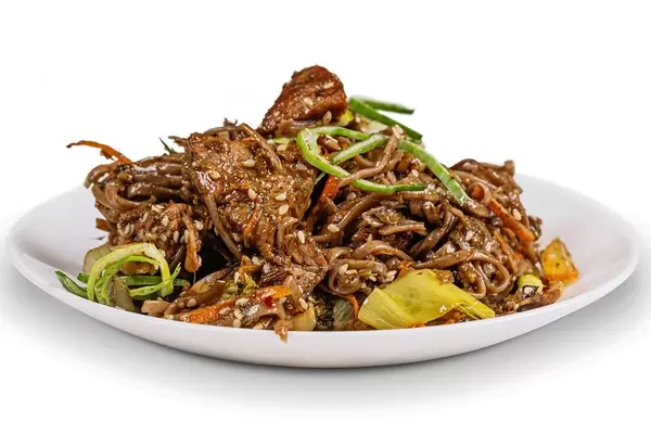 Soba noodles with pork in a spicy sauce