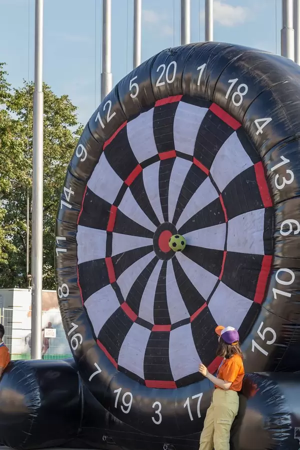 Soccer ball hitting a foot dart target