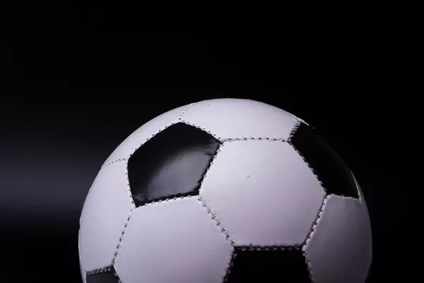 Soccer ball on black background