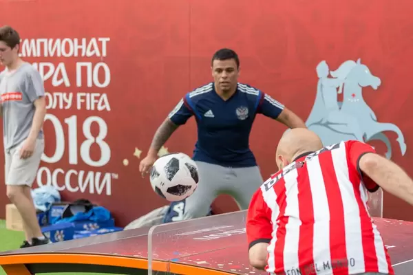 Soccer fans of different nationalities playing Teqball