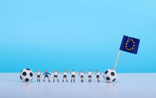 Soccer players with flag of European Union