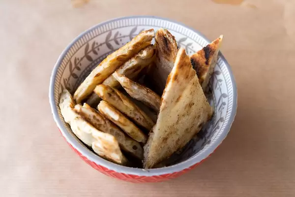 Soft Pita bread in a bowl at a greek restaurant