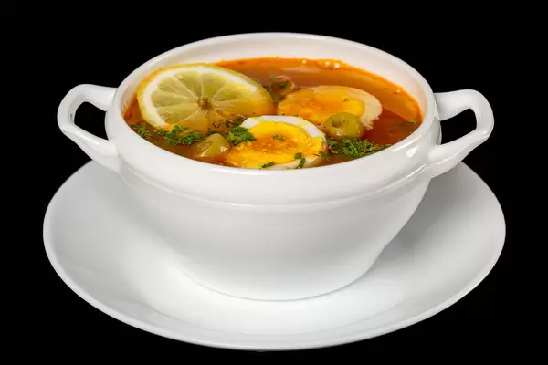 Solyanka russian soup with olives and lemon