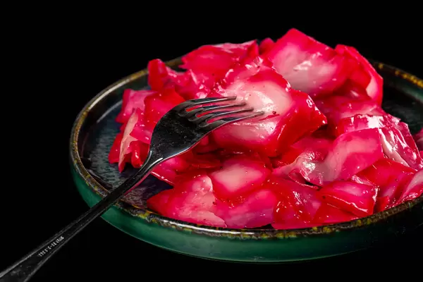 Sour cabbage with beets on plate