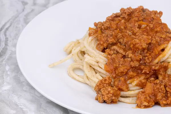 Spaghetti Bologneze served on the plate with copy space