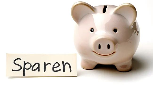 Sparschwein mit Aufforderung zum Sparen