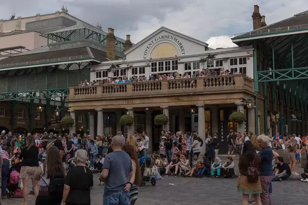 Spectators at Punch and Judy puppet show in London