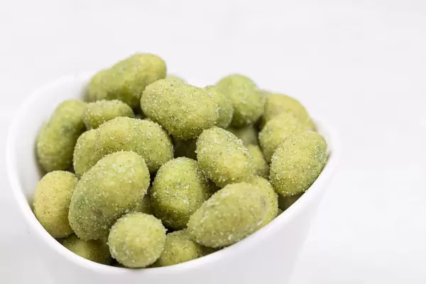 Spiced Wasabi Nuts served in the white bowl