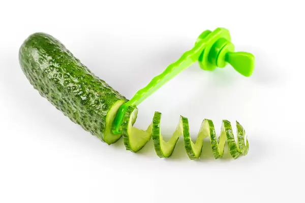 Spiral sliced cucumber on white
