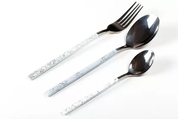 Spoon, fork and teaspoon on white background (Flip 2020)
