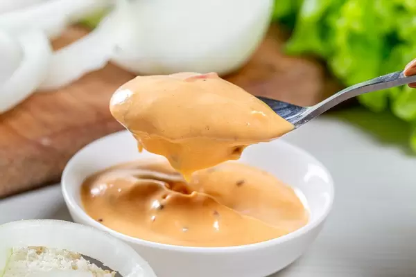 Spoon with hamburger sauce close-up
