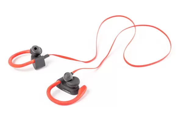 Sports red-black headphones on a white background