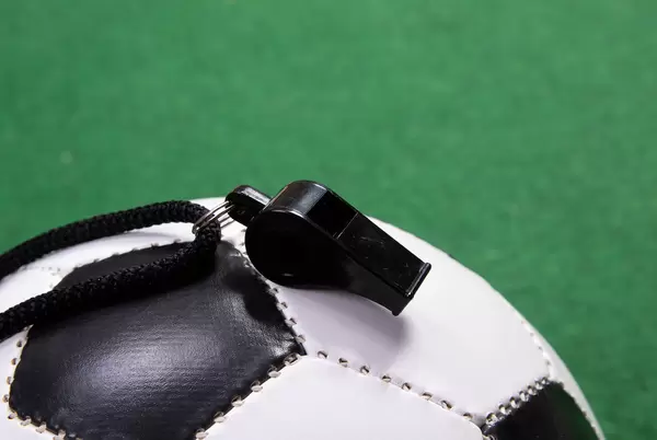 Sports whistle on a soccer ball