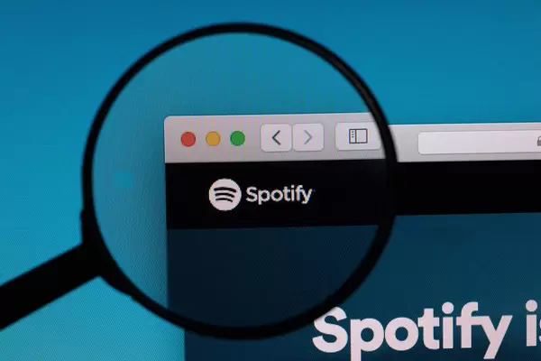 Spotify logo under magnifying glass