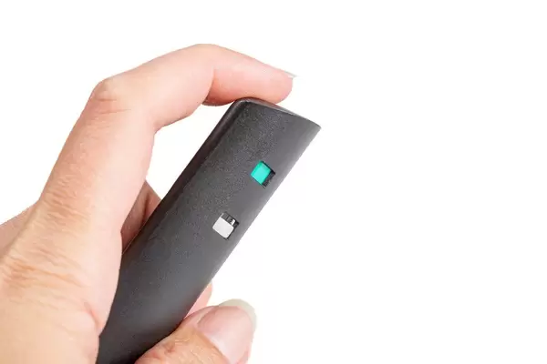 Spray to combat smoking addiction in a female hand