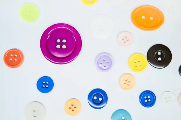 Spread color buttons on white background