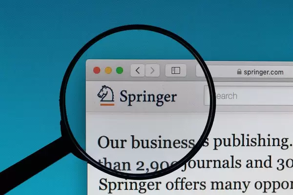 Springer logo under magnifying glass