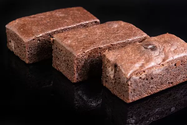 Square Chocolate Muffins on black reflective background