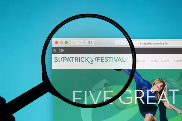 St. Patrick's Festival logo on a computer screen with a magnifying glass