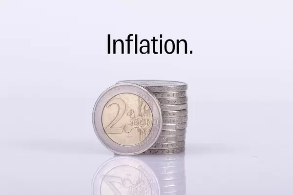 Stack of 2 Euro coins with Inflation text