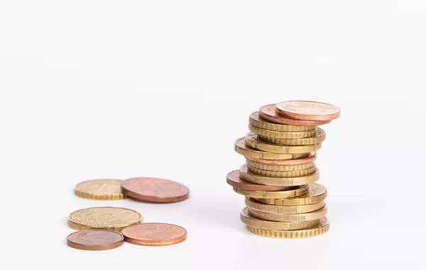 Stack of coins on white background