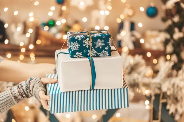 Stack of gifts on golden bokeh, merry christmas