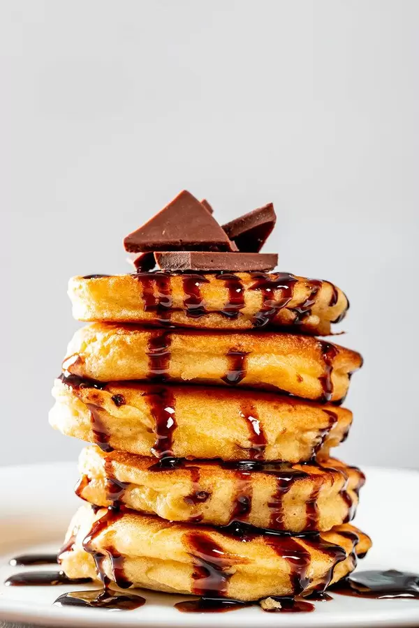 Stack of pancakes with chocolate closeup
