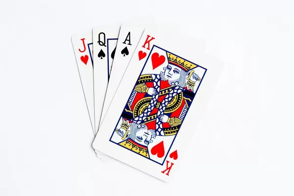 Stack of playing cards on white background