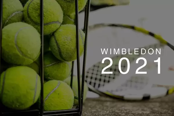 Stacked tennis balls in a basket, with tennis rackets in the background and the text "Wimbledon 2021" , the name of the annual sporting event in London