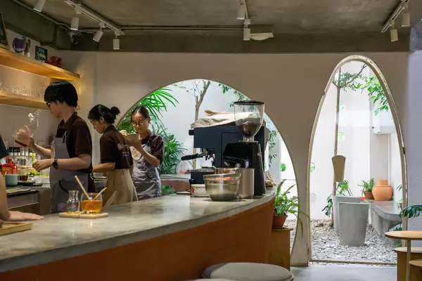 Staff preparing Coffee and Tea in a Cafe with Outdoor Space