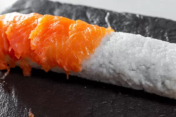 Stages of preparation of sushi rolls Philadelphia