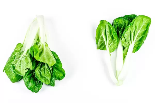 Stalks of fresh green bok choy on white background (Flip 2020)